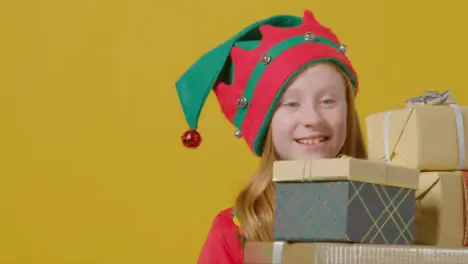 Close Up Young Girl Walking Holding Christmas Presents