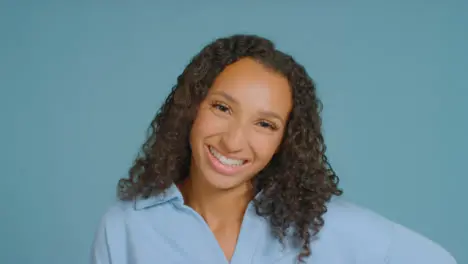 Portrait Shot of Young Adult Woman Smiling to Camera 05