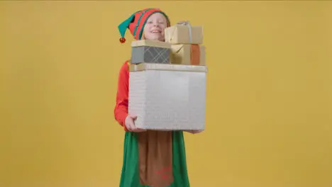 Young Girl Walking Holding Christmas Presents