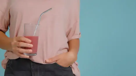 Close Up Shot of Young Adult Womans Hands Holding Smoothie 03