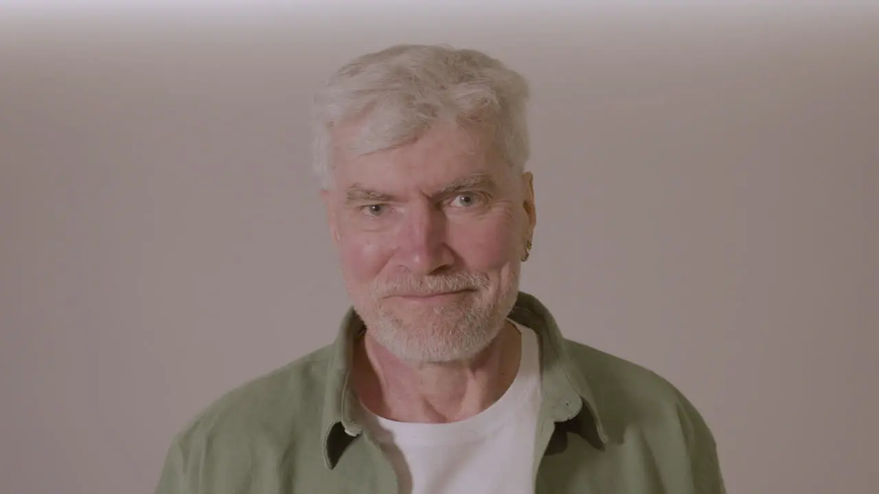 Portrait Of A Senior Man Smiling At Camera