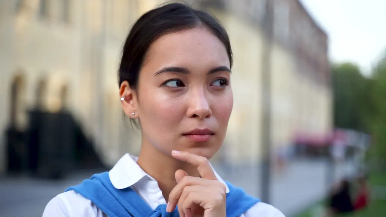 Thoughtful Woman Thinking Concentrated Rubbing Her Chin And Looking Aside With Pensive Expression