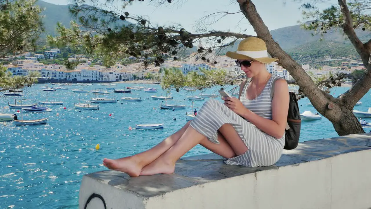 A woman rests by the sea near Cadaques in Catalonia 7