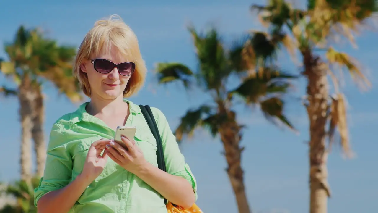 Woman In Summer Clothes Typing On Your Phone