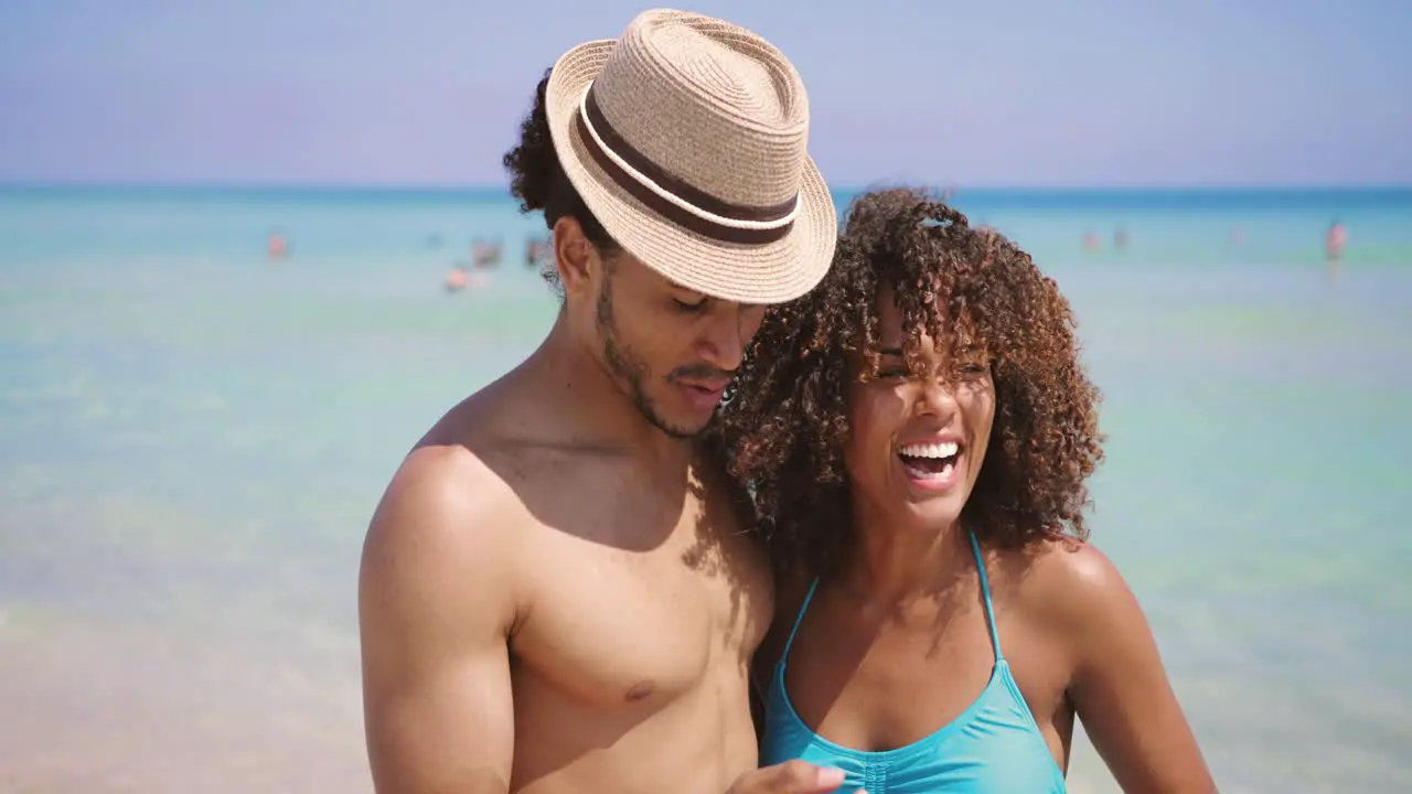 Couple taking selfie on beach