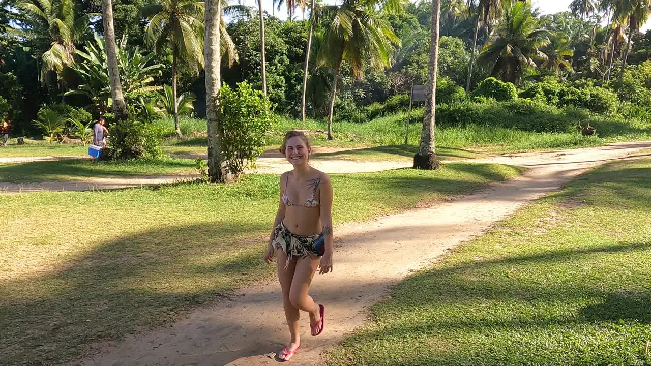 Tourist Girl Having fun at Brazilian Beach