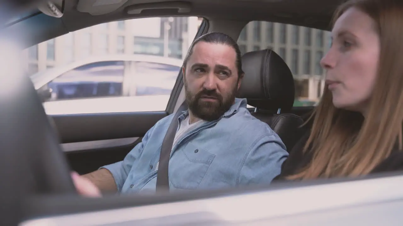 A Man Makes A Woman Desperate By Scolding Her At The Wheel Of A Car