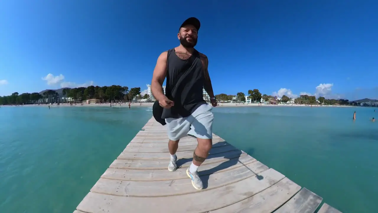 360 camera man running on the jetty