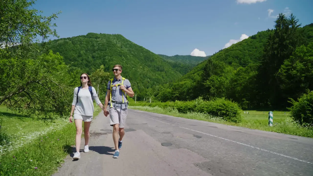 Young Couple Hitchhiking 4K Video