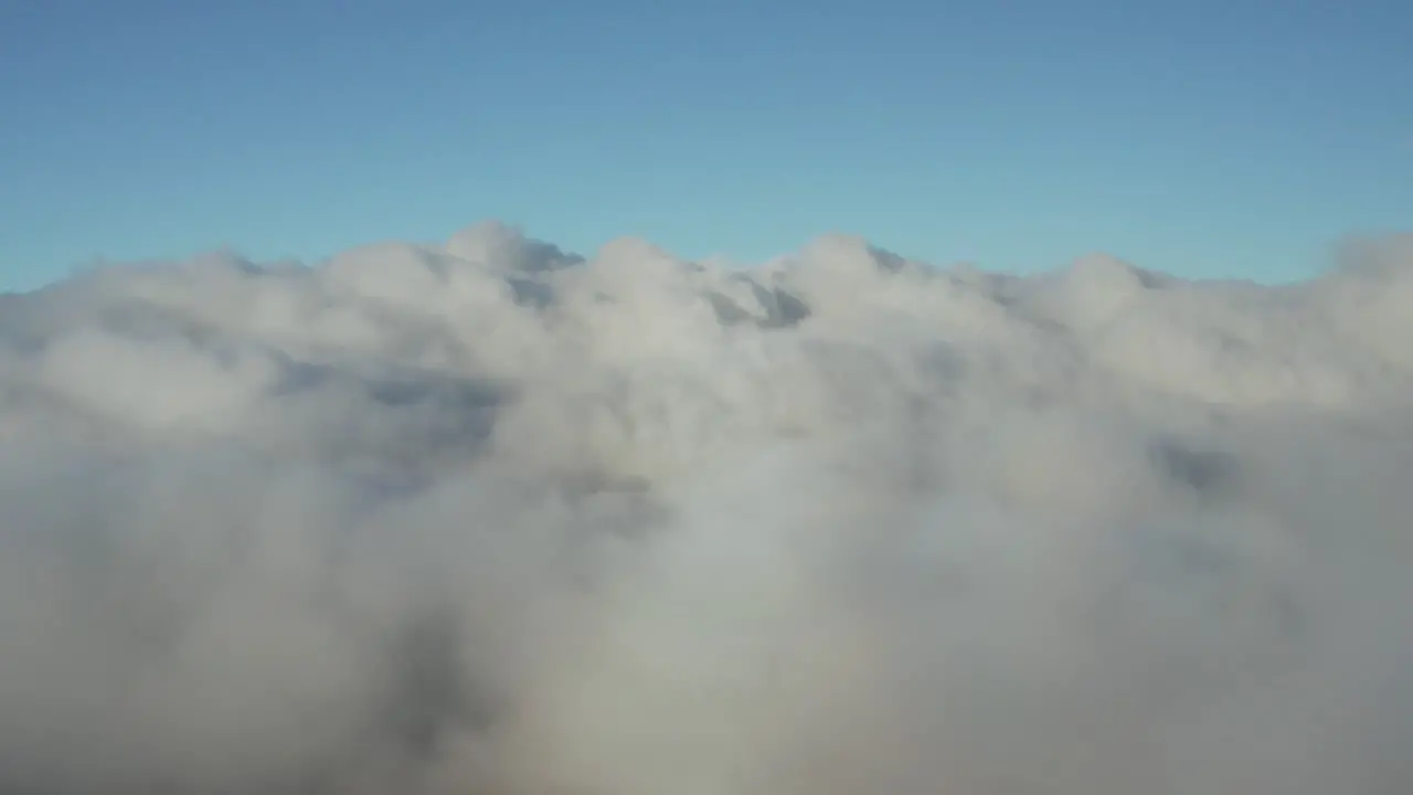 Aerial view above clouds blue and white Hawaii