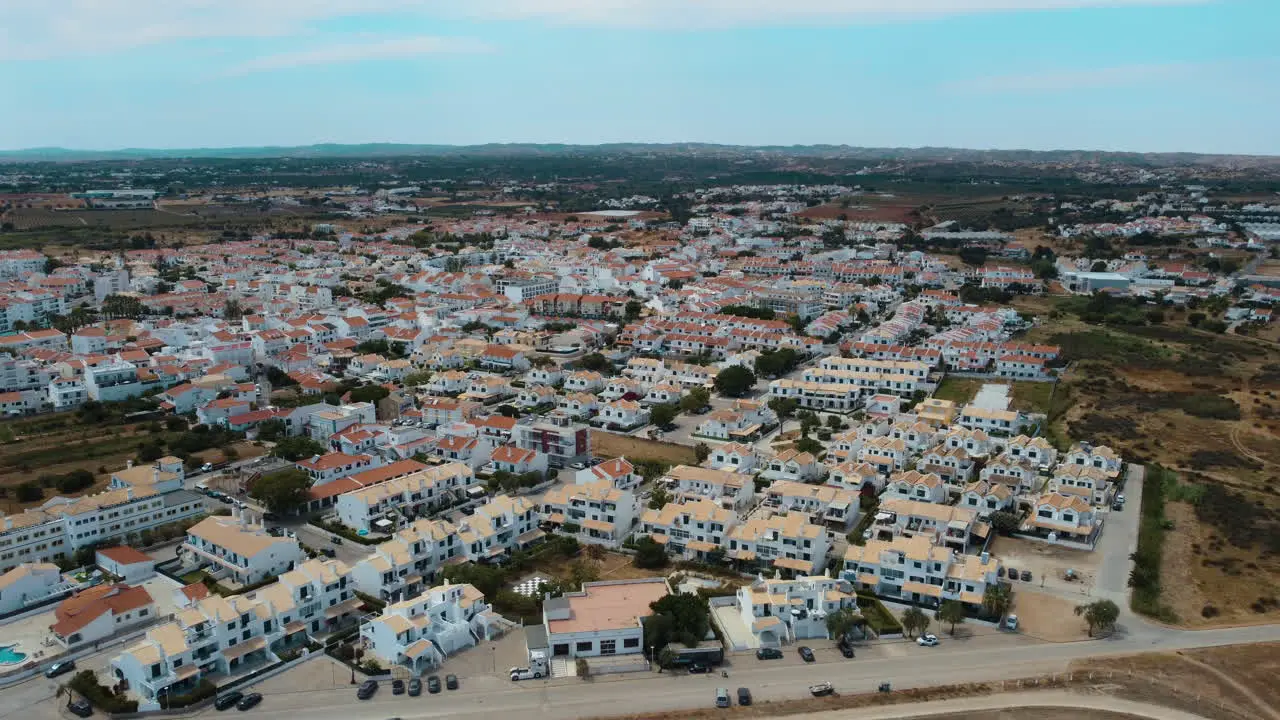 Bird's Eye View Of Vacation Houses At The Coastline Of Altura In Algarve Portugal In Summer