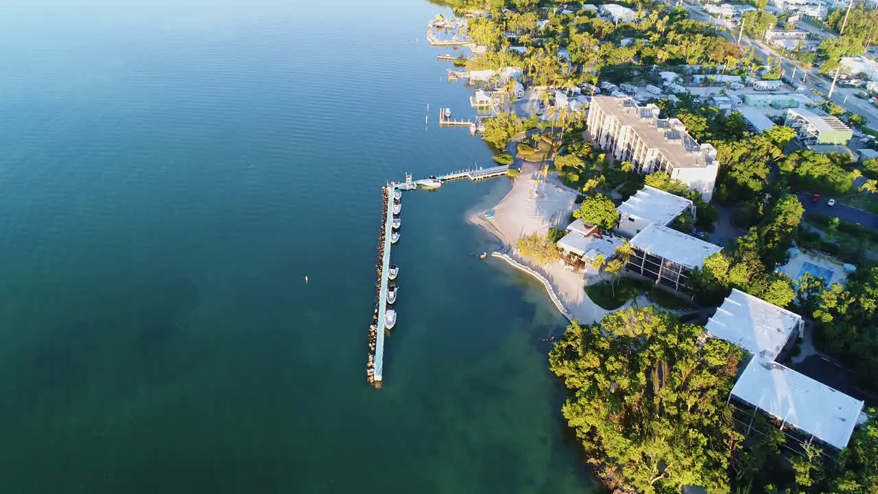 Aerial Tilt Down over Dock with Boats at Resort in Islamorada Florida Keys