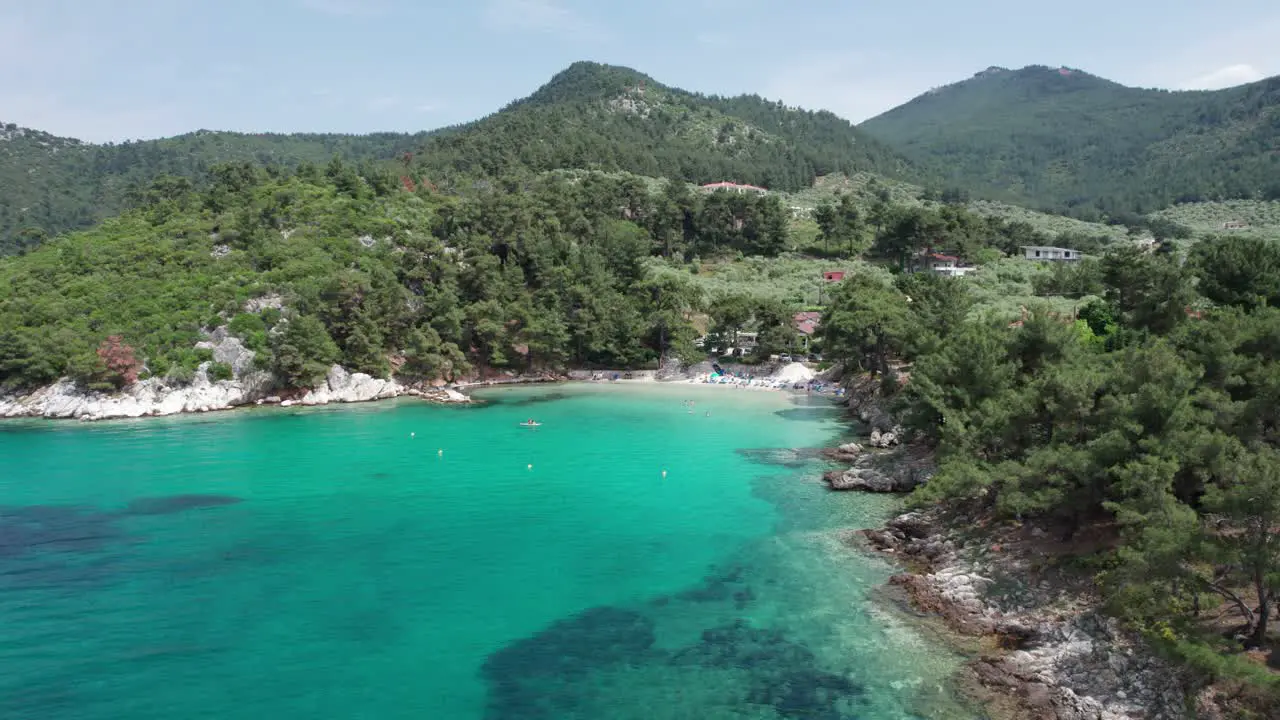 Revealing Glifoneri Beach's Pristine Oasis With Transparent Waters and Enveloped by Luxuriant Green Foliage Thassos Island Greece Europe