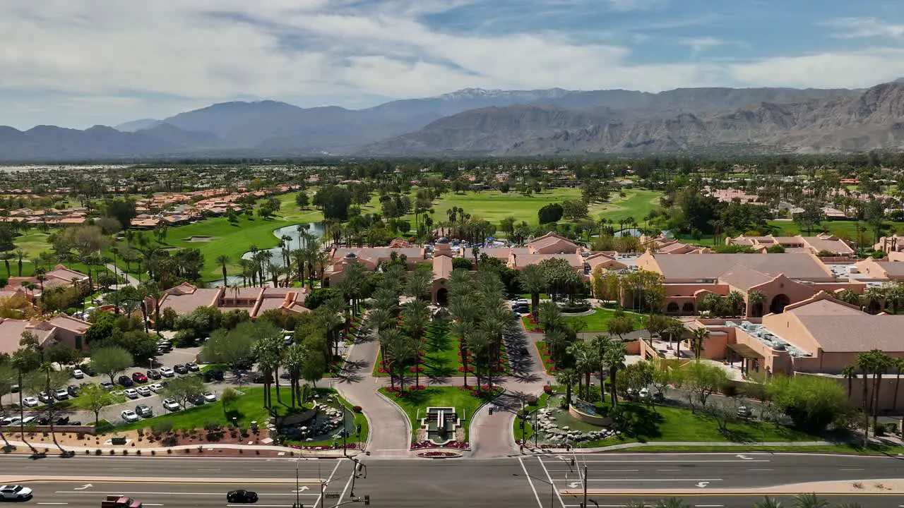 Low aerial view flying over the entrance of the Westin Rancho Mirage Golf Resort and Spa near Palm Springs California