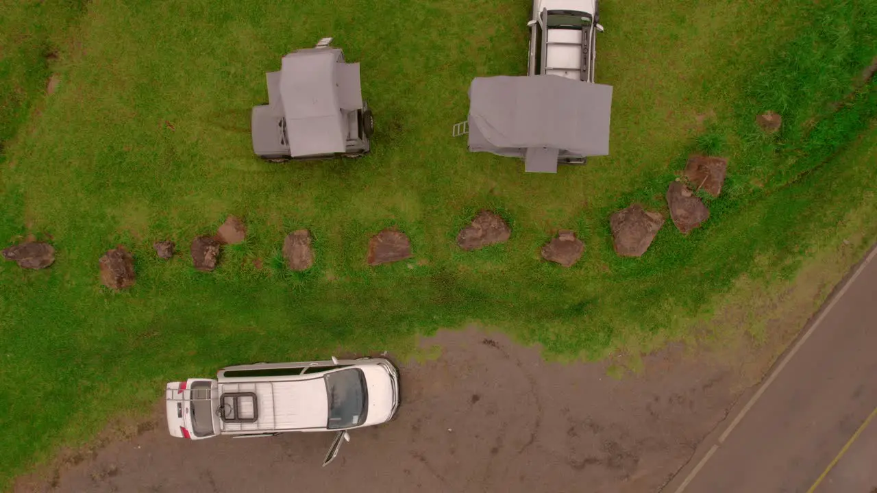 Bird-eye aerial over camping vans and built up tents on it outdoor car exploration vacation and camping concept