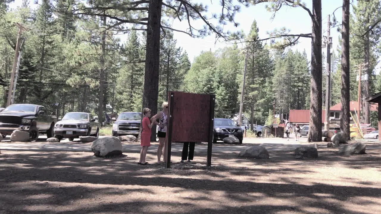 Mother and sons read map near Lake Tahoe