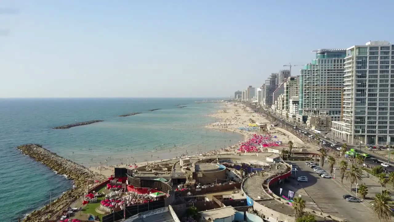 Drone footage of the populated beachfront of Tel Aviv Israel