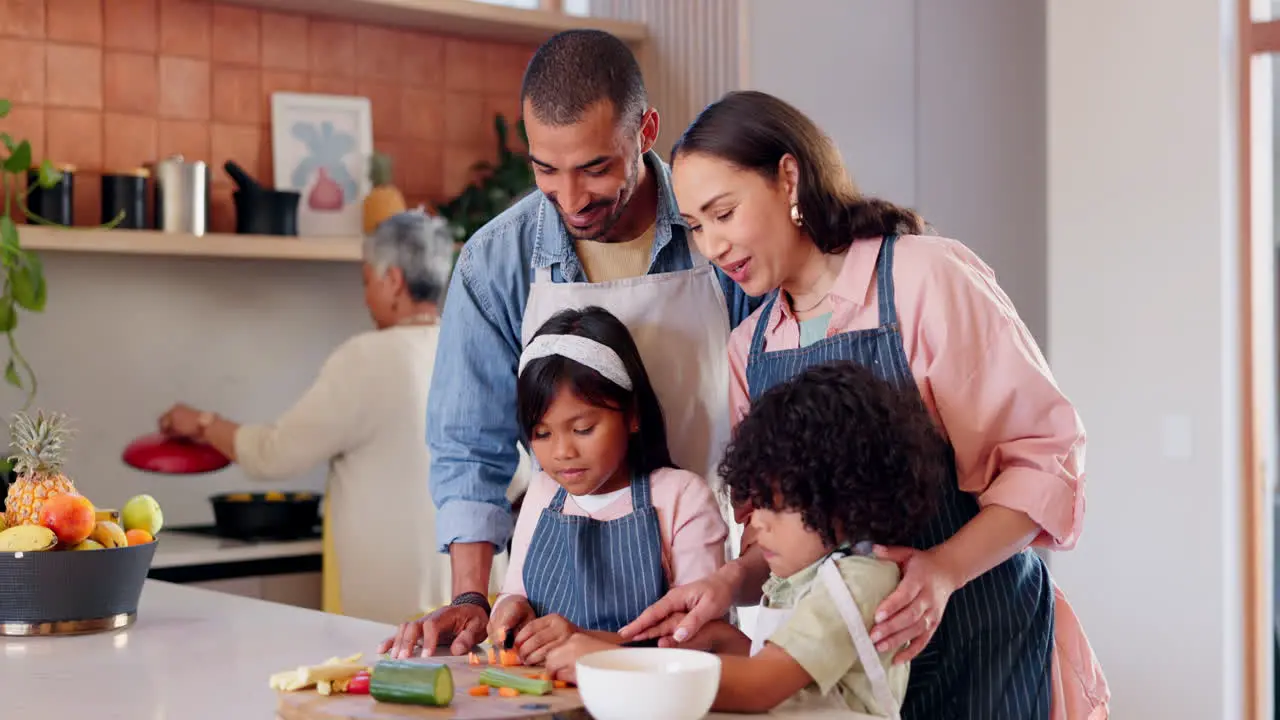 Family children and cooking vegetables in kitchen