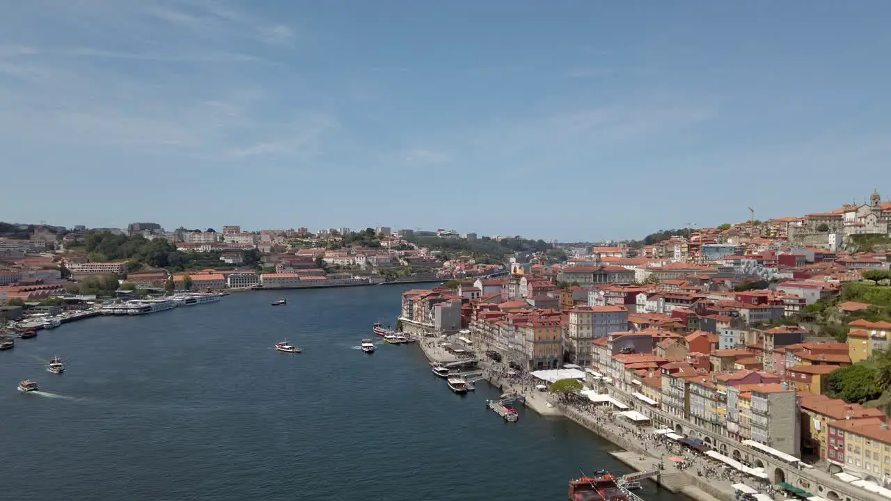 Nice views of boats sailing on Douro river Oporto on a sunny day