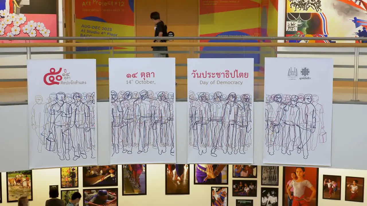 Spectators walking around and looking at the various artworks displayed on the different floors of Bangkok Arts and Culture Centre in Pathum Wan District Bangkok Thailand