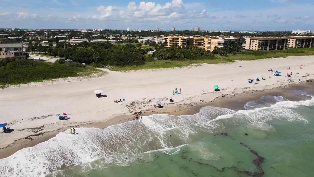 Touristic Cocoa Beach in Florida with People on Summer Vacation Aerial