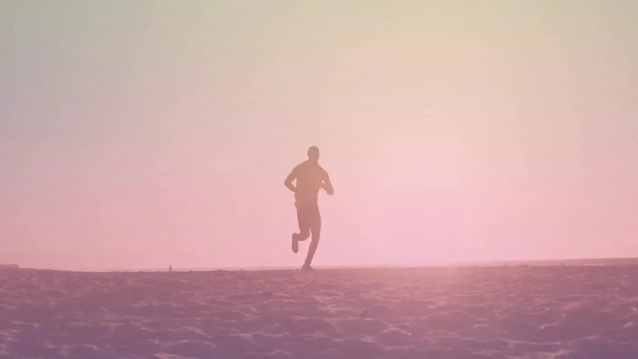 Animation of over african american man running at beach