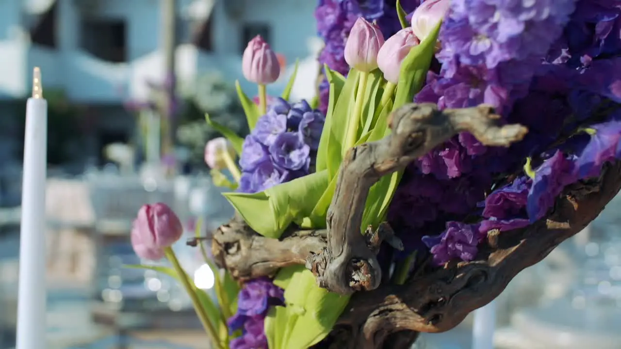 Close-up shot of a flower in a vase at an outside event