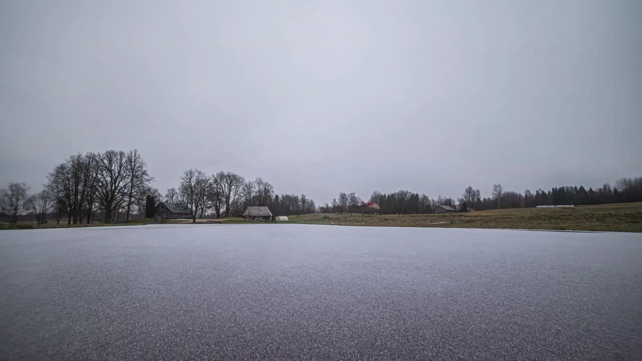 Hyper lapse transition spring to winter of house near lake near Riga Latvia