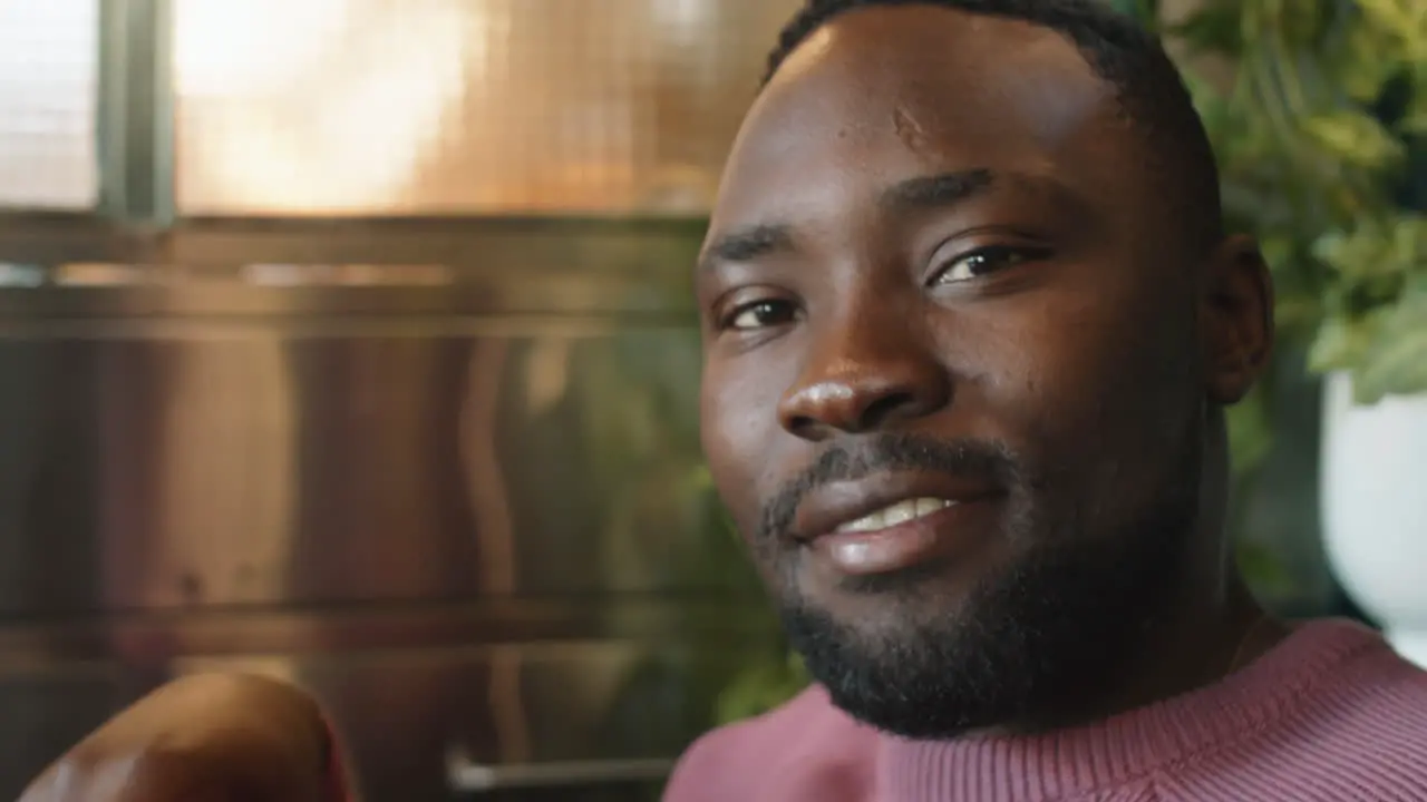 Portrait of Smiling Black Man in Cafe