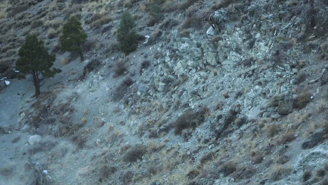 Rocky Hillside and Steam from Geothermal Springs at Hot Creek Geological Site California US