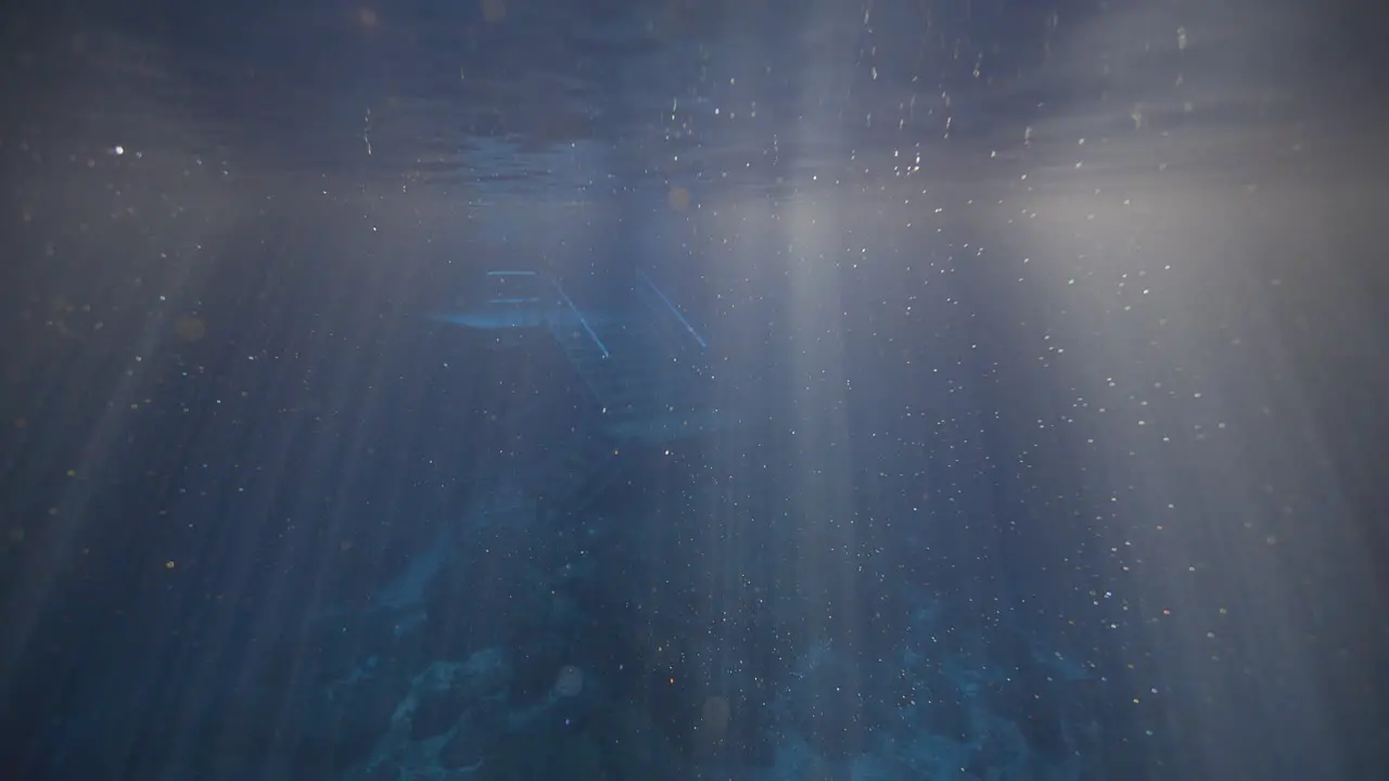 View of sunlight ripples in natural spring water at Devil's Den Prehistoric Spring