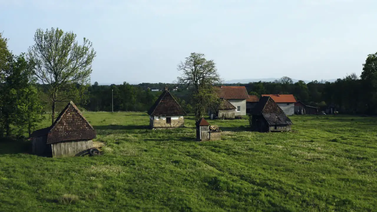 Drone flying around the village and filming old vintage houses from mud and rocks