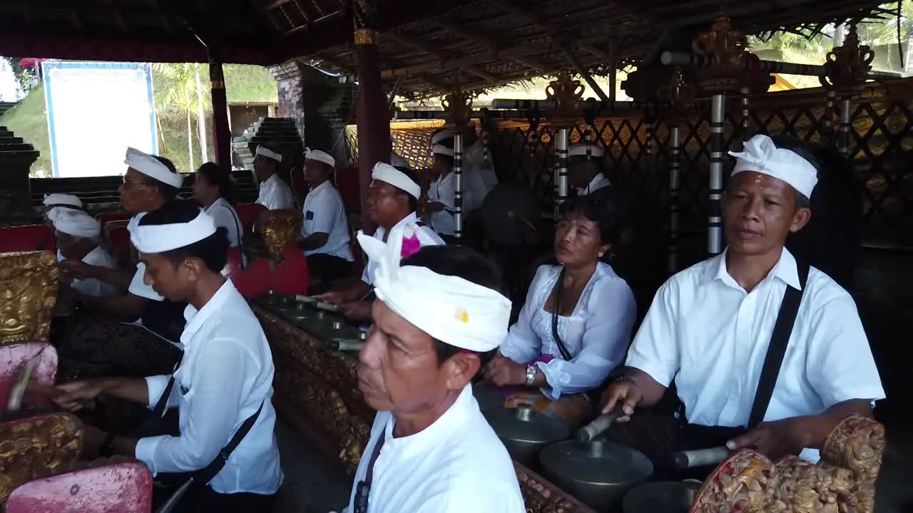 Balinese People Play Gamelan Gong Kebyar Ancient Music at Hindu Temple Ceremony in Local Gianyar Village Indonesia