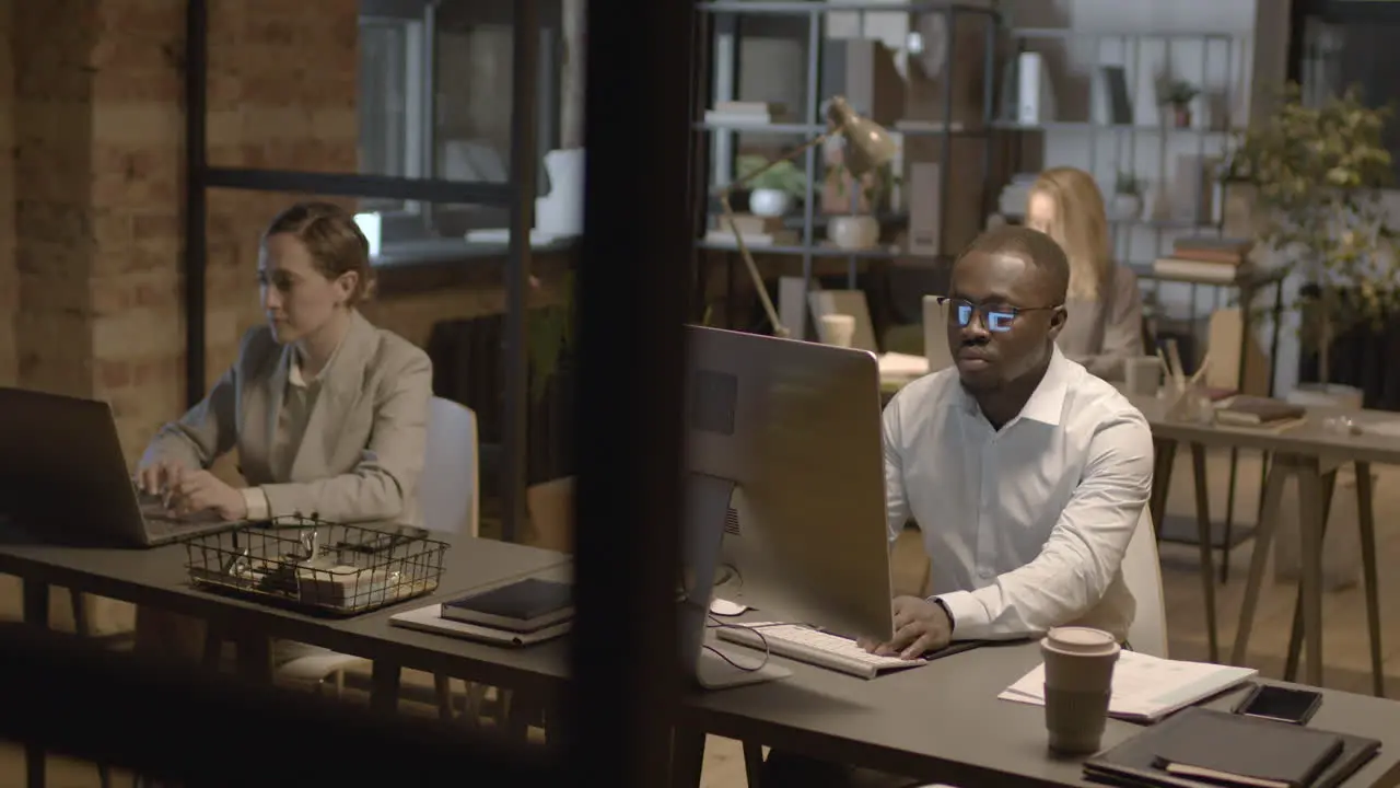  Employees Working On Computer In The Office