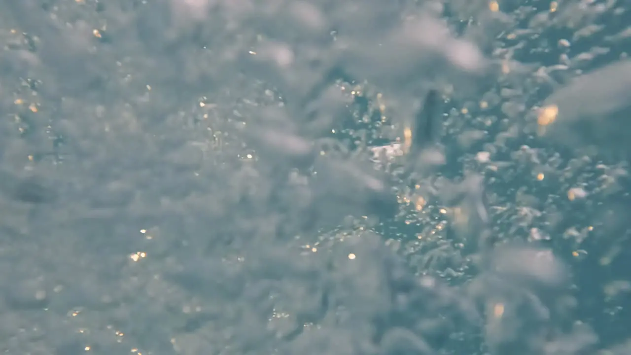 Cinematic slow motion shot of bubbles underwater creating interesting shapes 4K 120FPS Slomo