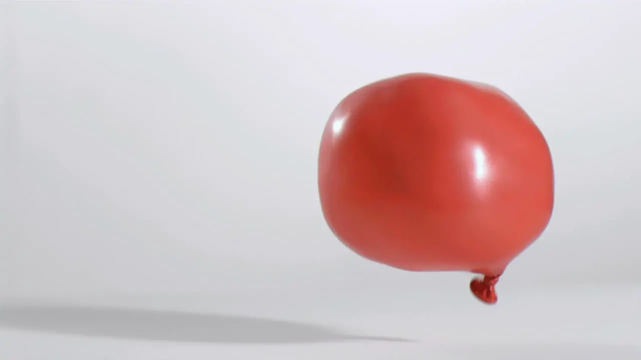 Red balloon moving in super slow motion