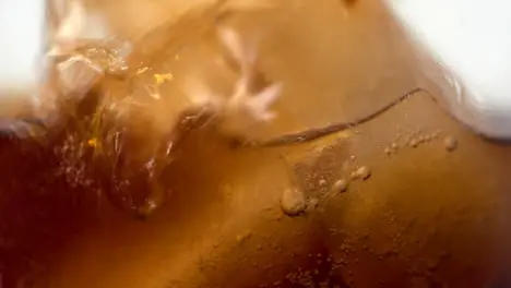 Slow Motion Extreme Close Up Soft Drink Pouring In Glass