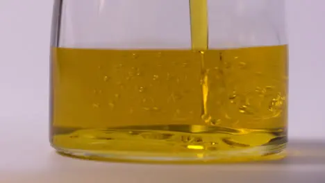 Slow Motion Extreme Close Up Food Oil Pouring In Jar