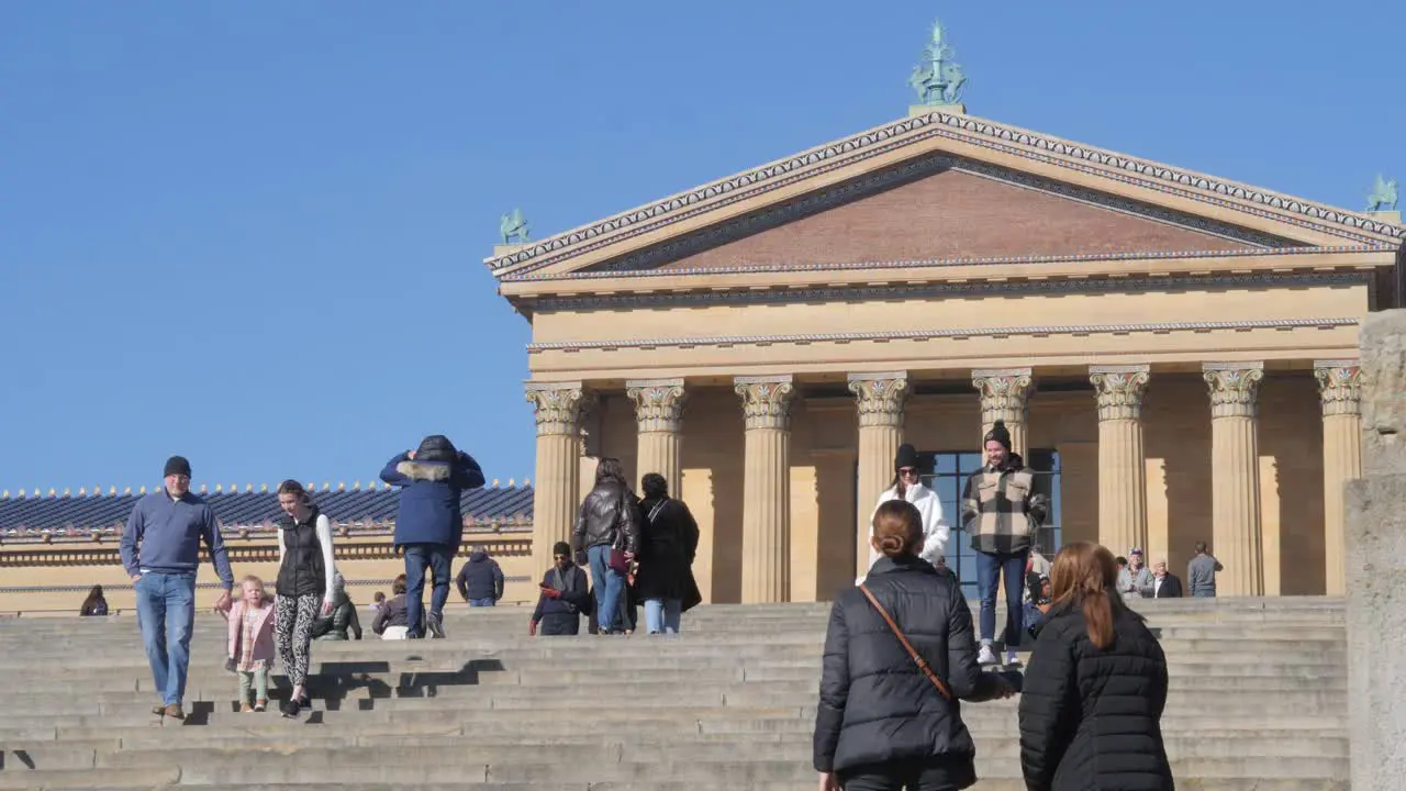 People walking up the stairs of the Philadelphia Museum in slow motion