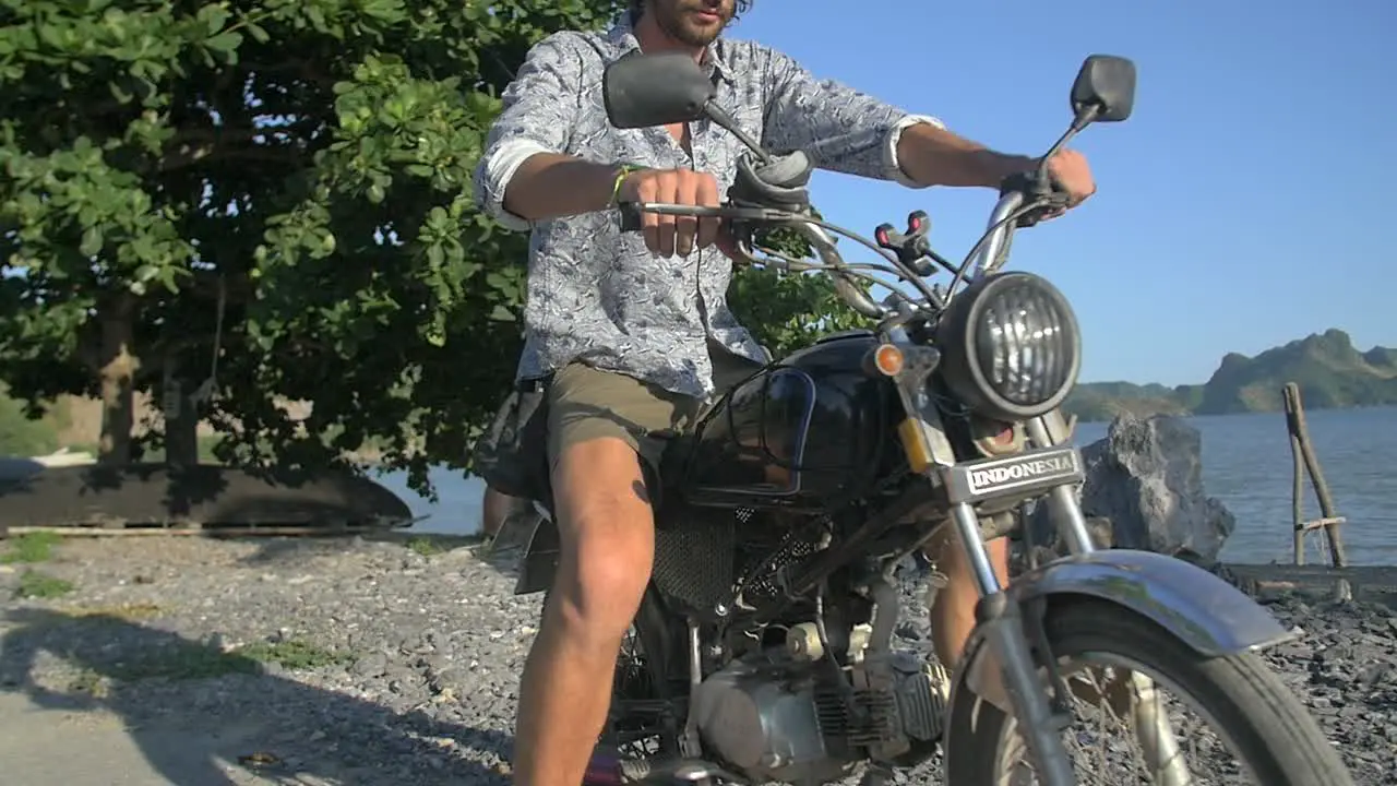 Man Riding Off on Motorbike