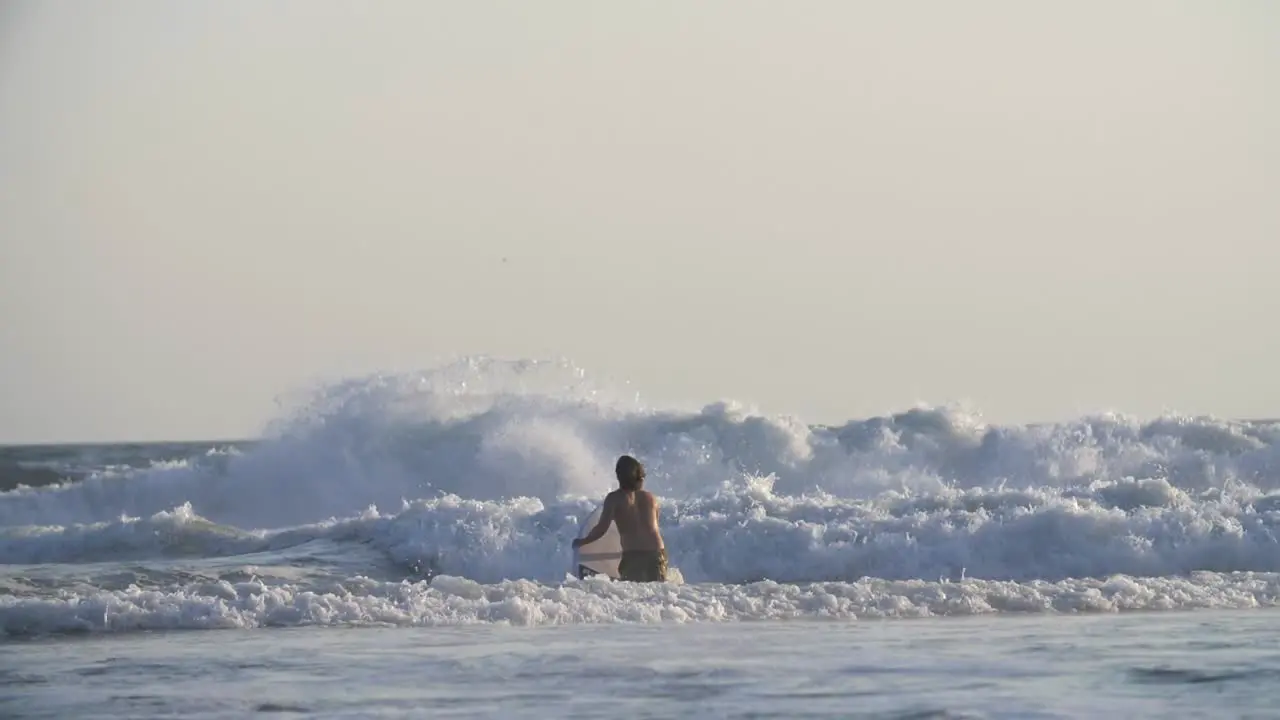 Surfer Paddling in the Waves