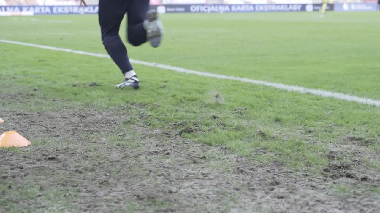 a professional football players warm up in slow mo