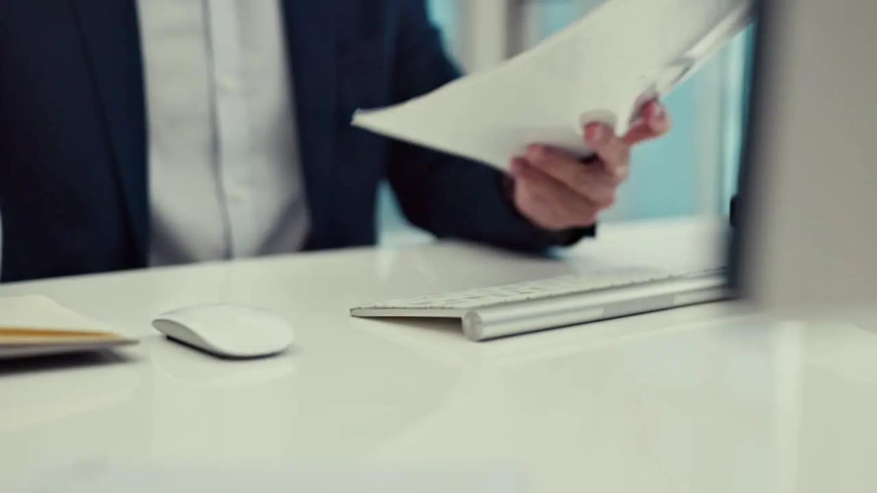 Hands documents and a business man typing