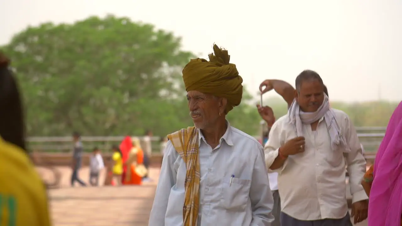 Elderly Indian Man Scratching Nose