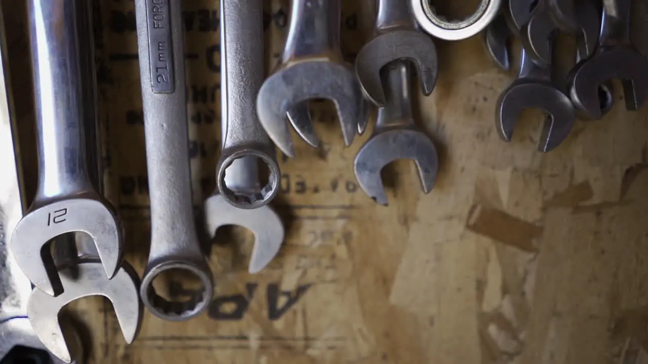 Wrenches hanging above work bench