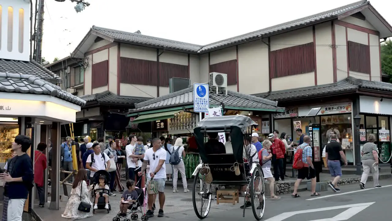 Busy Street Scene With Rickshaw And Tourists On Path Leading To Arashiyama Bamboo Forest