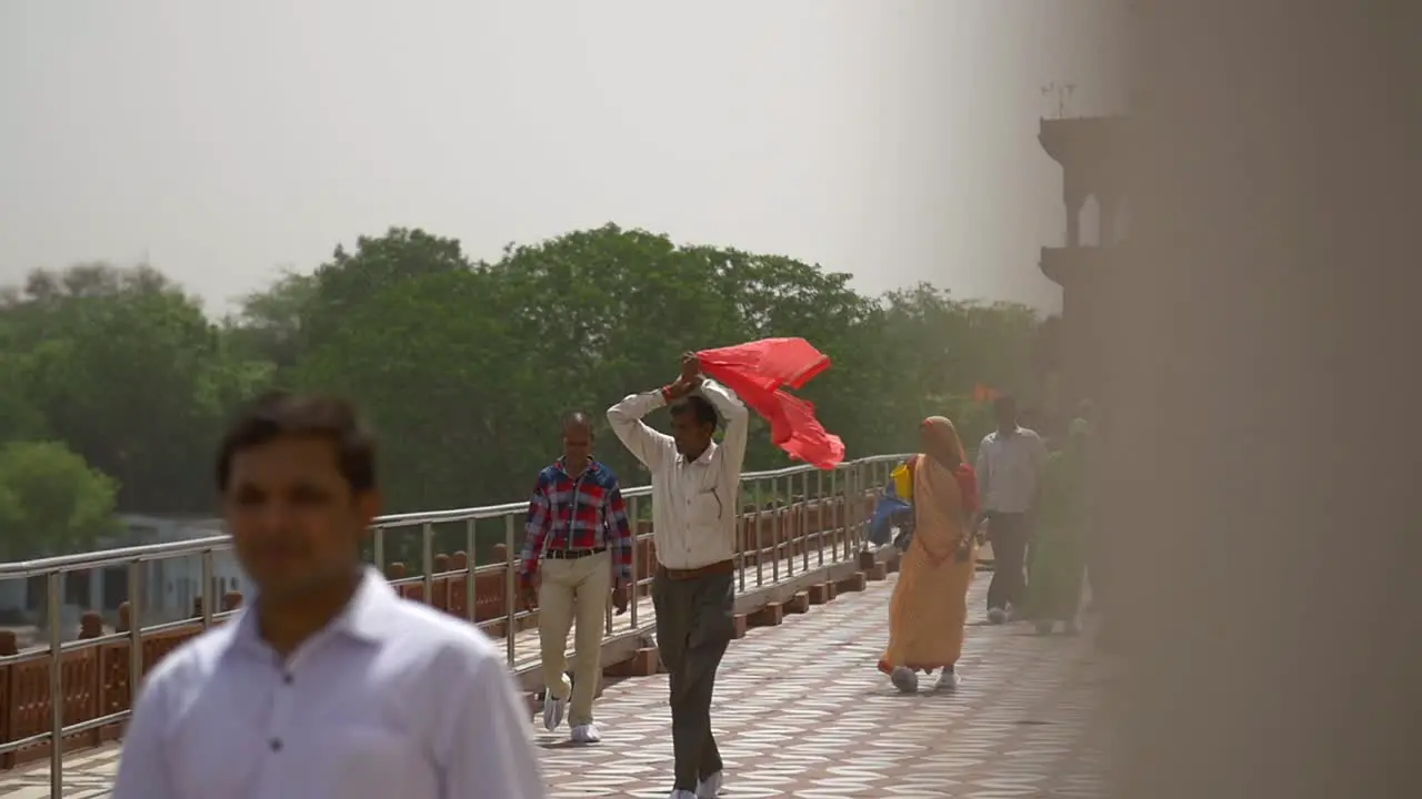 Indian Man Covering Head With Red Shawl