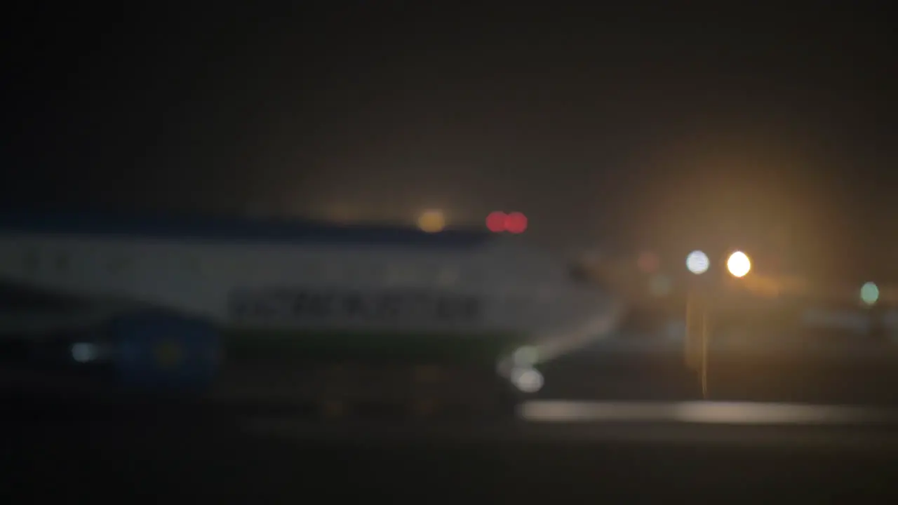 Arrival of the airplane at night defocus