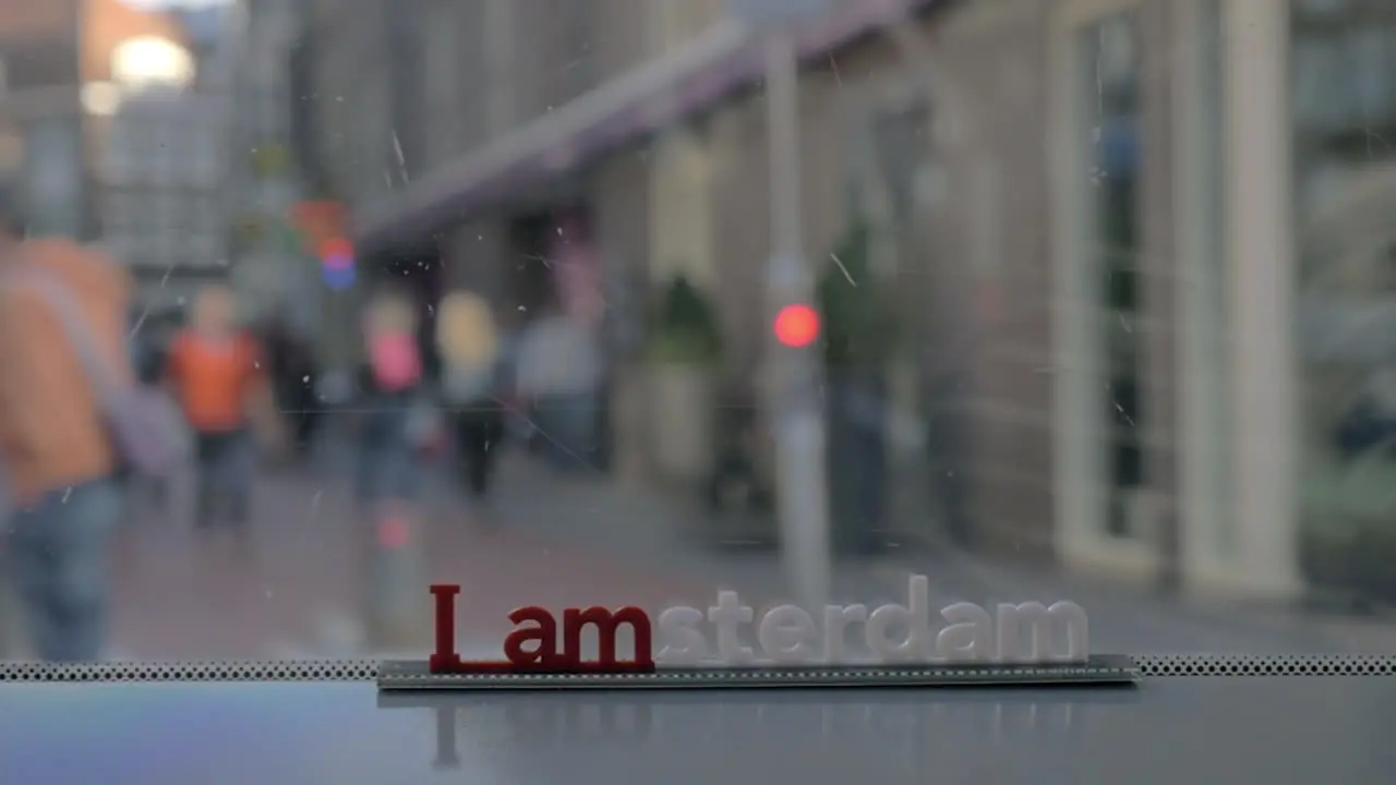 Viewing city streets through tram window Amsterdam