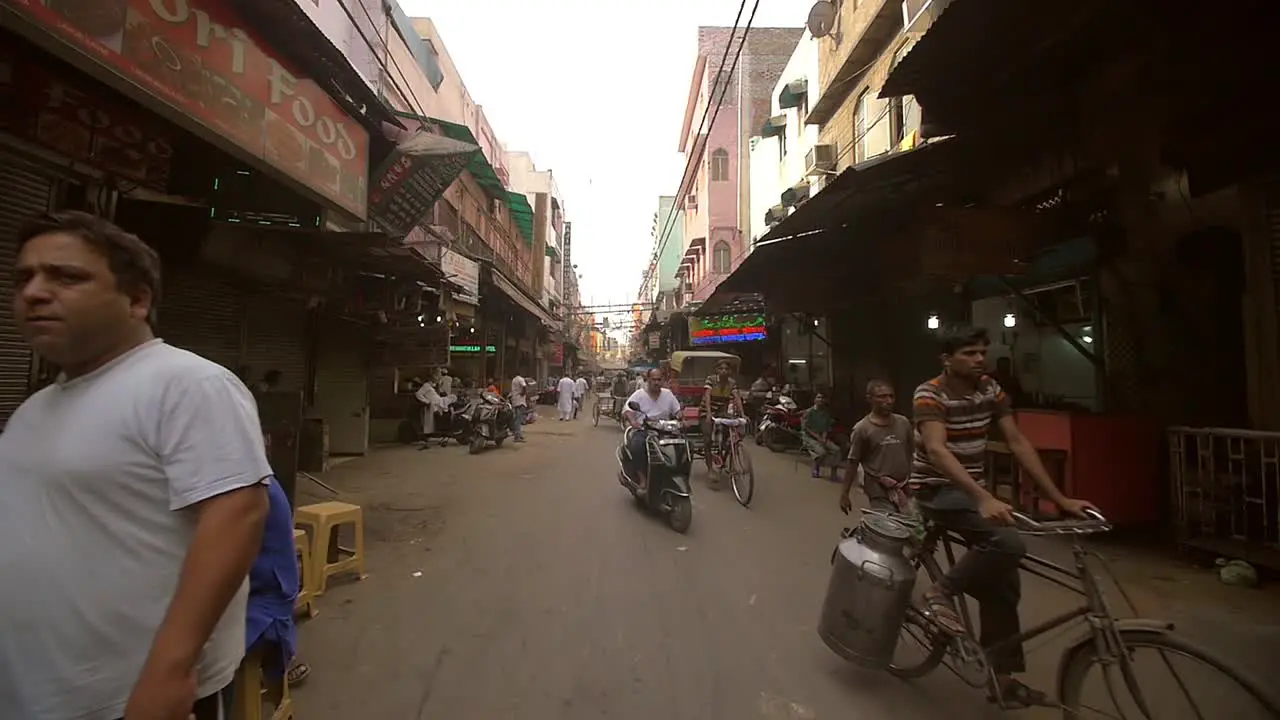 Rickshaws and Mopeds in a Delhi Street